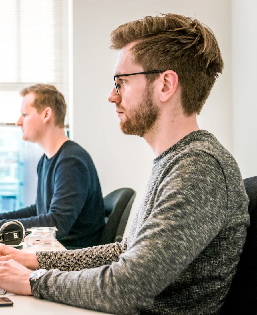 Two developers working at their desks with monitors